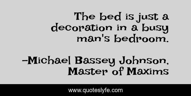 The bed is just a decoration in a busy man's bedroom.