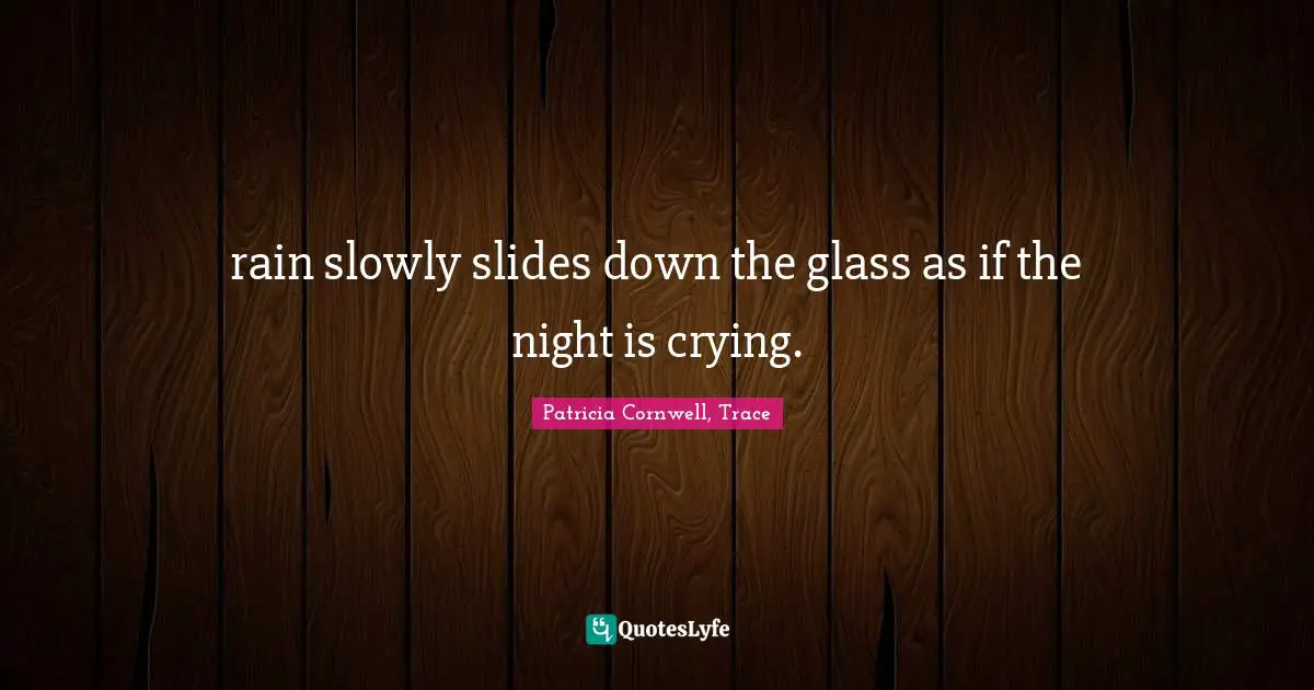 rain slowly slides down the glass as if the night is crying.